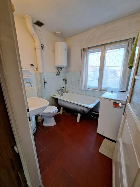 Dom do remontu w dzielnicy Ogrodów, 151 m², garaż.
