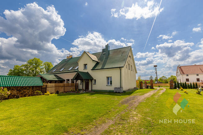 Dom nad rzeką koło Ełku, w stylu dworkowym