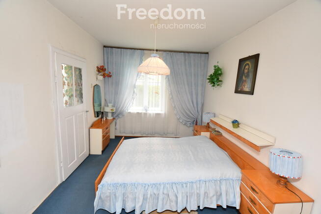 Domek w otoczeniu zieleni, Skomlin