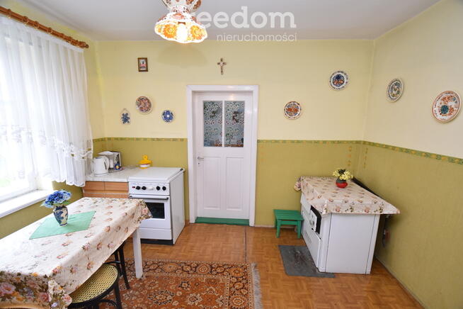 Domek w otoczeniu zieleni, Skomlin