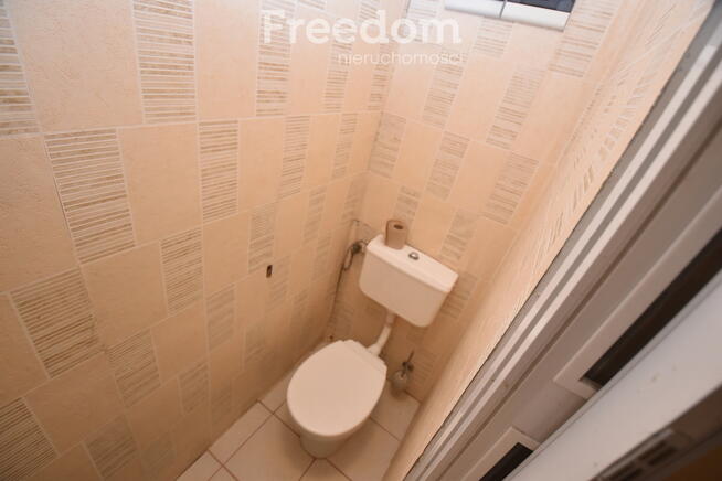 Domek w otoczeniu zieleni, Skomlin