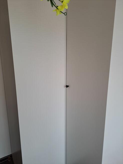 Szafa narożna i fotel jednoosobowy z funkcją spania