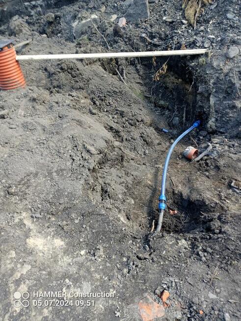 usługi koparko-ładowarką cat.