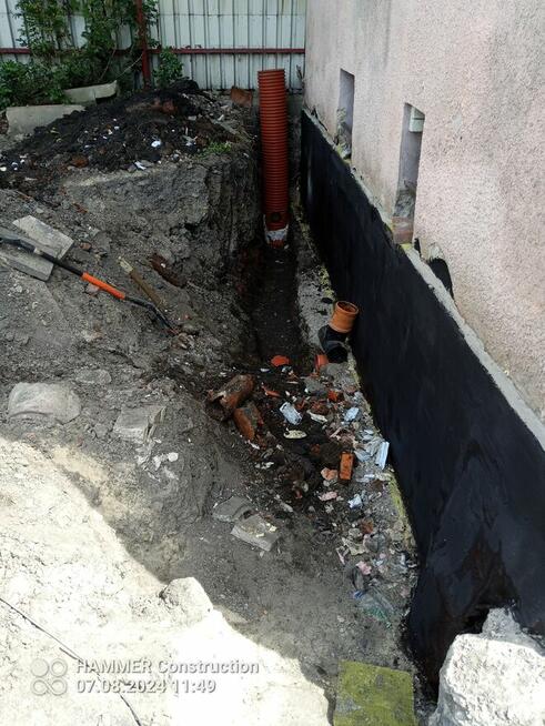 usługi koparko-ładowarką cat.