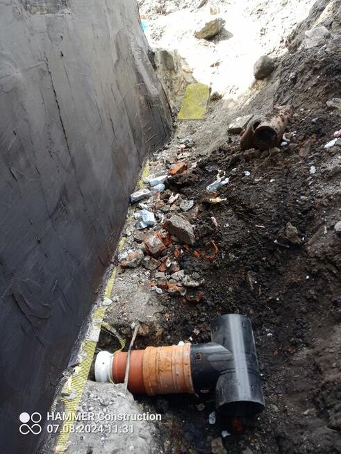 usługi koparko-ładowarką cat.