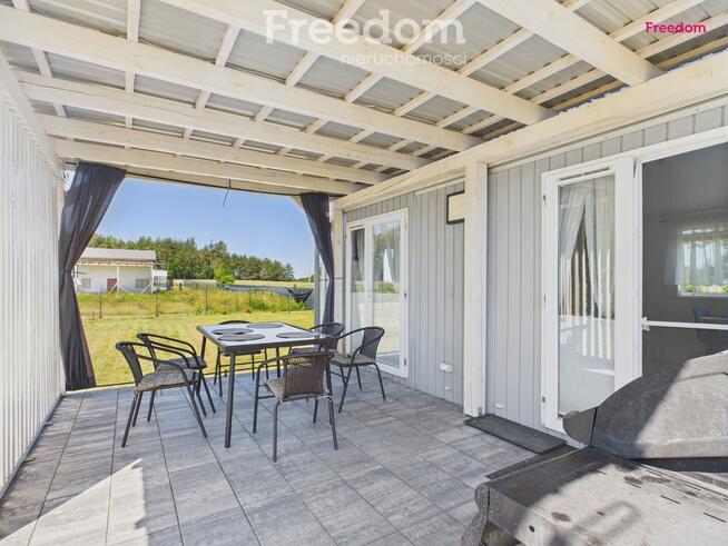 Domek holenderski z tarasem na działce 1055m2.