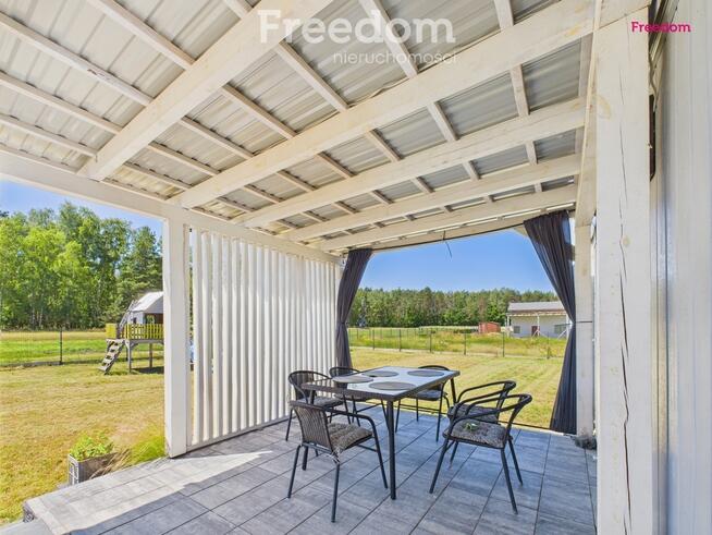 Domek holenderski z tarasem na działce 1055m2.