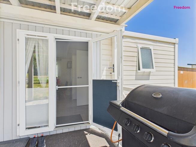 Domek holenderski z tarasem na działce 1055m2.