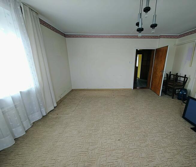 Sprzedam połowę domu z działką i garażem