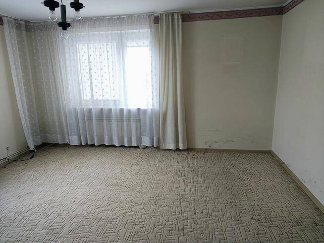 Sprzedam połowę domu z działką i garażem