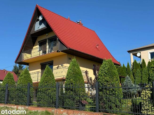 Dom z garażem i ogrodem w pięknej okolicy