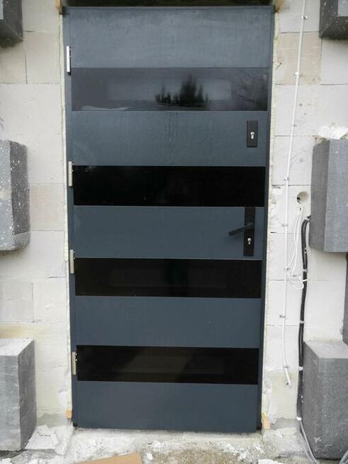 Drewniane drzwi zewnętrzne dębowe od PRODUCENTA