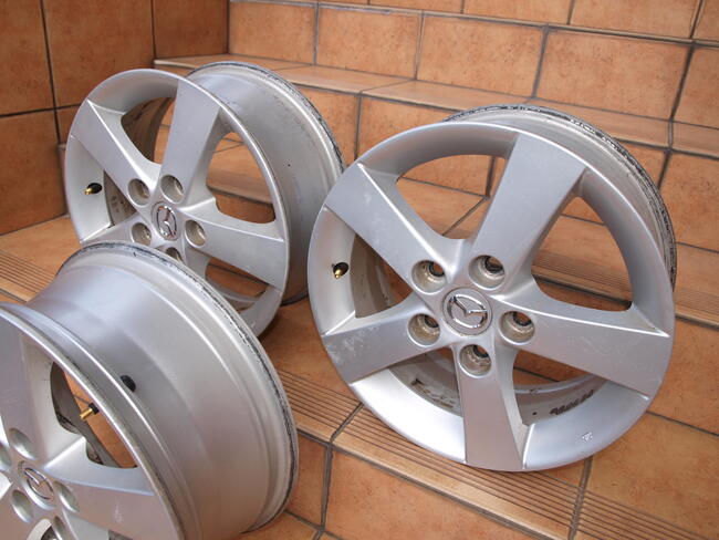 Mazda felgi alufelgi 15 oryginalne (komplet 4 sztuki)