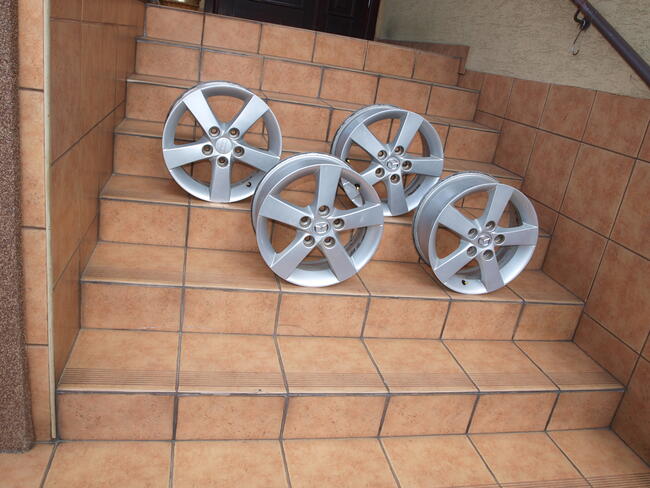 Mazda felgi alufelgi 15 oryginalne (komplet 4 sztuki)