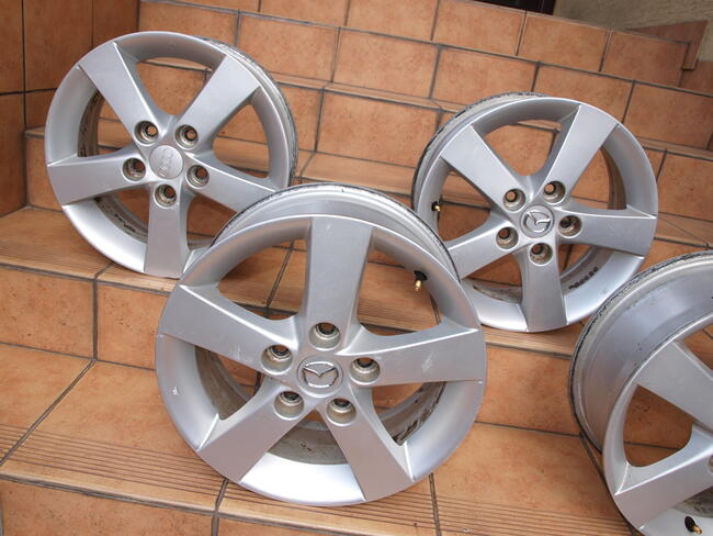 Mazda felgi alufelgi 15 oryginalne (komplet 4 sztuki)