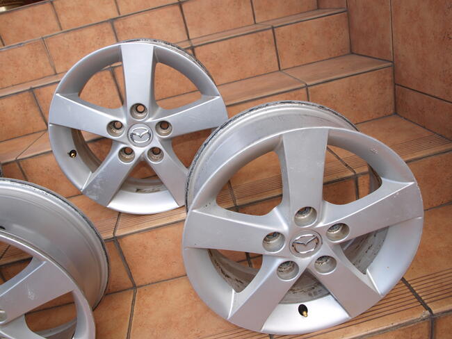 Mazda felgi alufelgi 15 oryginalne (komplet 4 sztuki)