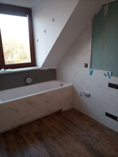 Układanie glazury , paneli Warszawa