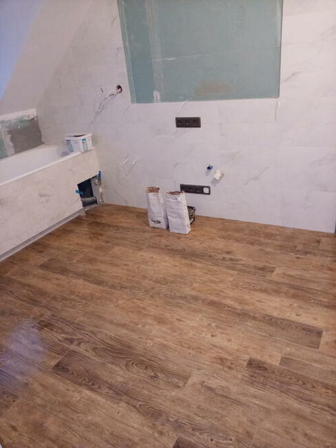 Układanie glazury , paneli Warszawa