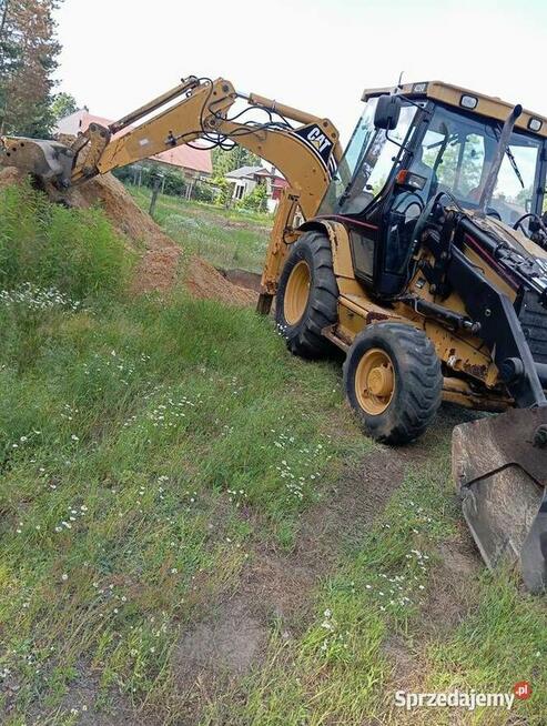 Usługi koparko-ładowarką (CAT 428D)