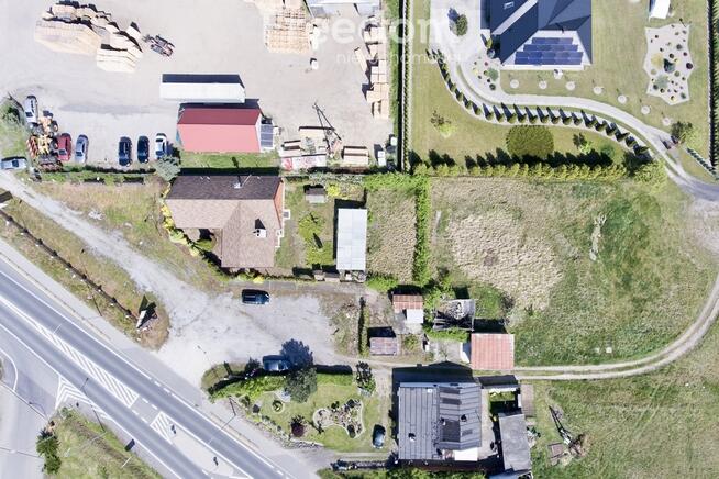 Działka zabudowana budynkiem drewnianym