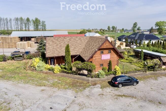 Działka zabudowana budynkiem drewnianym