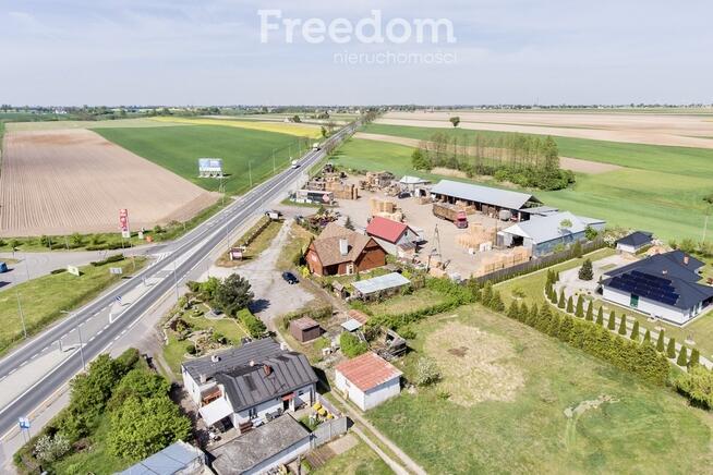 Działka zabudowana budynkiem drewnianym