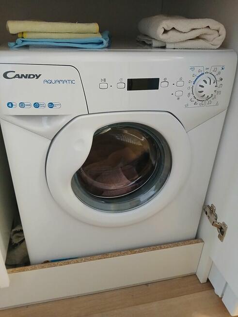 Uszkodzona 2 letnia mini pralka Candy, przeznaczona na częśc