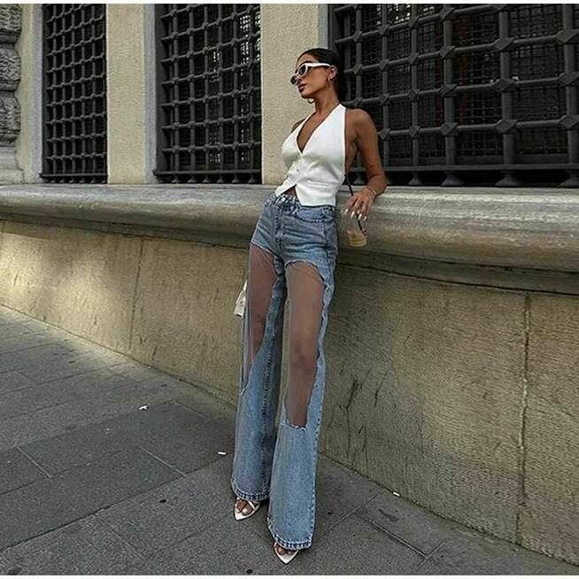 Designerskie jeansowe z przezroczystymi panelami na kolanach