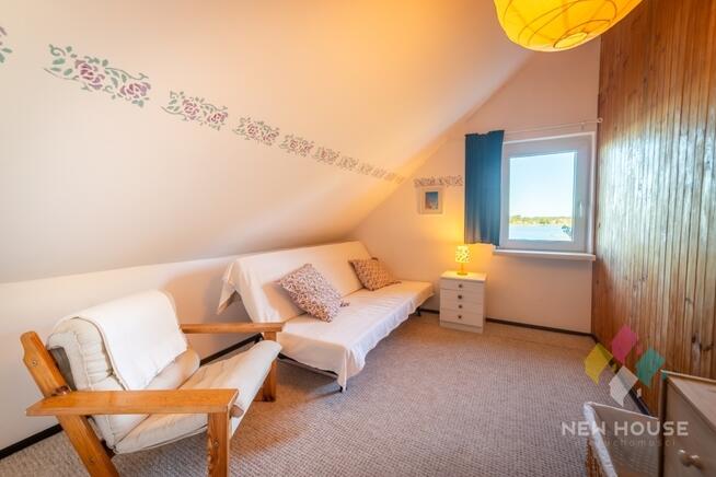 Stare Sady, dom z linią brzegową jeziora Tałty