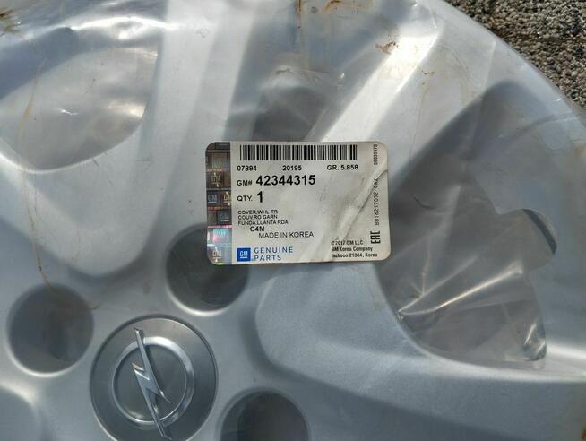 Kołpak Opel 15 423-315 nowy Corsa Adam cena za sztukę