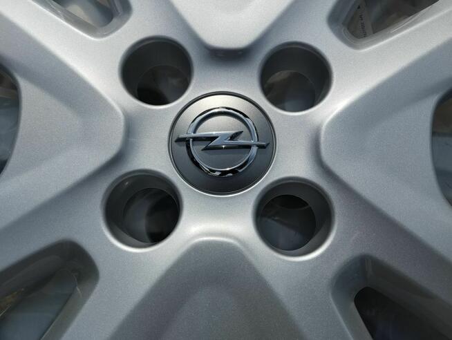 Kołpak Opel 15 423-315 nowy Corsa Adam cena za sztukę