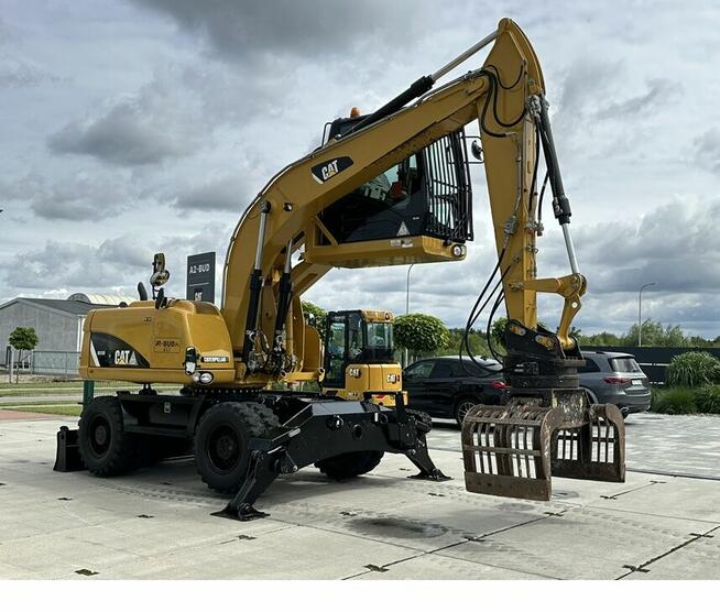 KOPARKA PRZEŁADUNKOWA CAT M313D