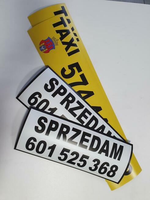 oznaczenia taxi Kraków cenniki herby magnesy numery boczne