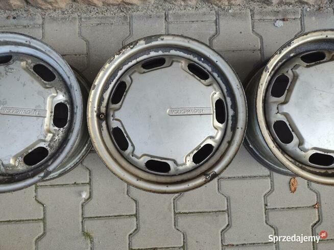 Felgi VW 14 z kołpakami OEM Passat 357601025A/B