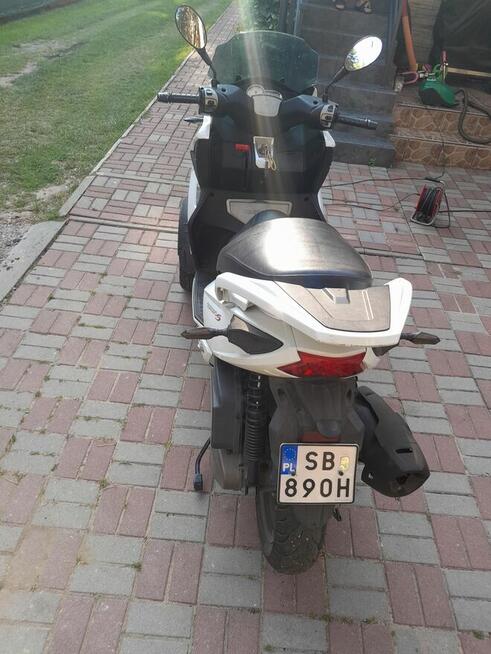 Motocykl guadro tròjkołowiec