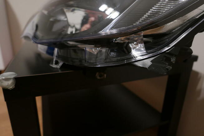 Opel Astra J IV lampa przednia lewa