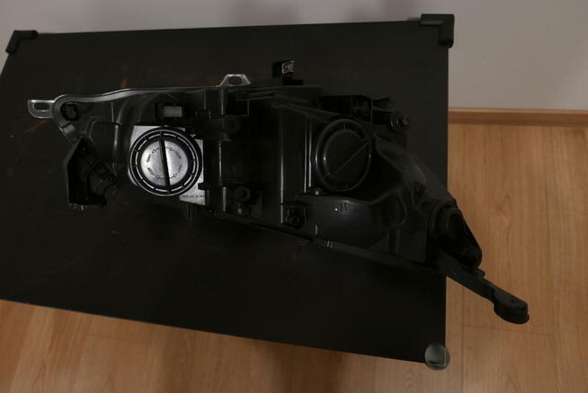 Opel Astra J IV lampa przednia lewa