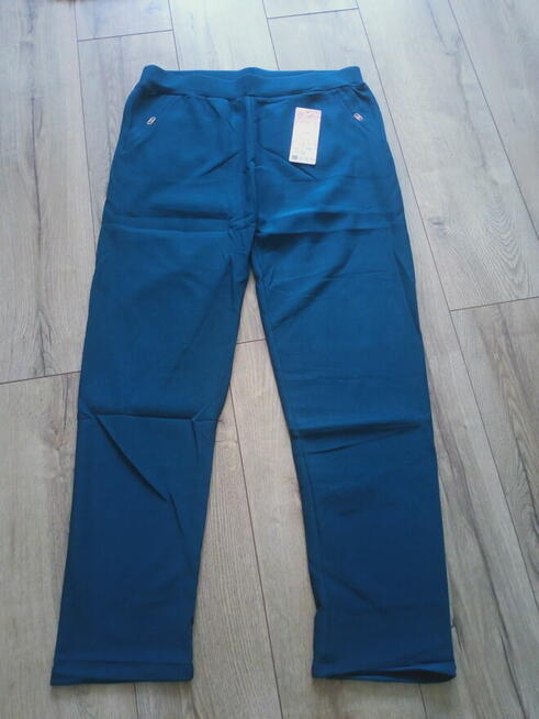 Duże turkusowe spodnie damskie 7/8xl