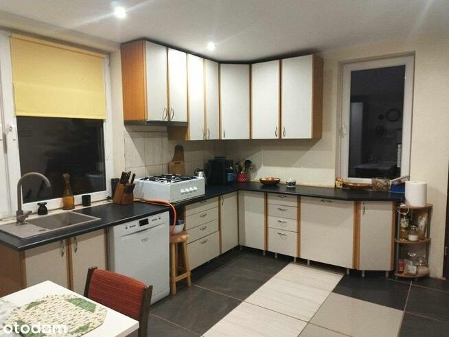 Urokliwy dom z fotowoltaiką i przestronnym ogrodem