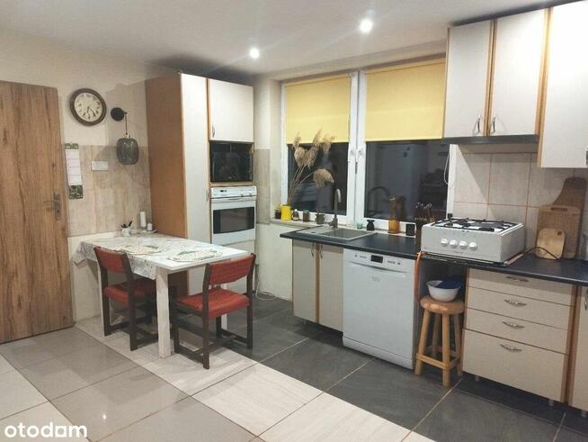 Urokliwy dom z fotowoltaiką i przestronnym ogrodem