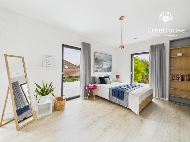 Nowoczesny wolnostojący dom z pięknym ogrodem