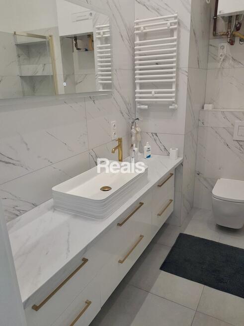 Słoneczne mieszkanie w domu szeregowym.