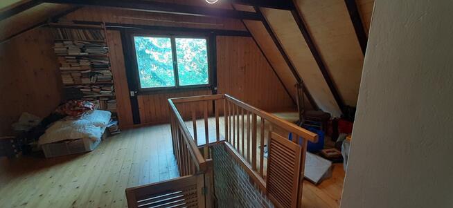 Łacha, drewniany dom na działce 1423 m