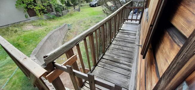 Łacha, drewniany dom na działce 1423 m