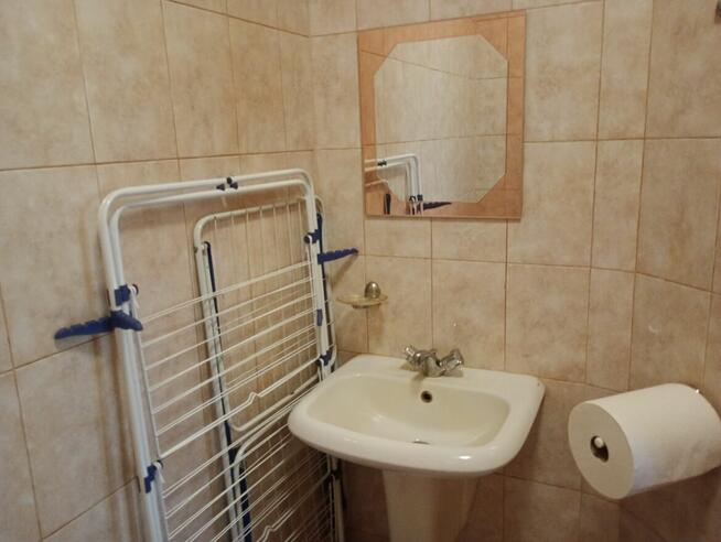 Dom w stylu dworku polskiego z ogrodem i garażem