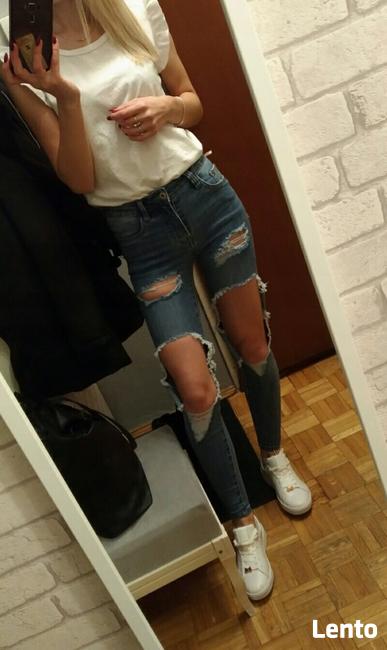 Jeansy z dziurami XS