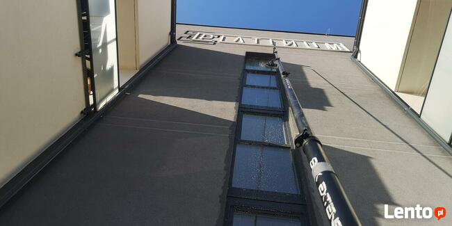 Wysokościowe mycie okien, witryn, fasad i przeszkleń