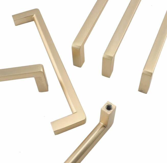 Nowoczesny uchwyt meblowy z serii VELOX złoty mat