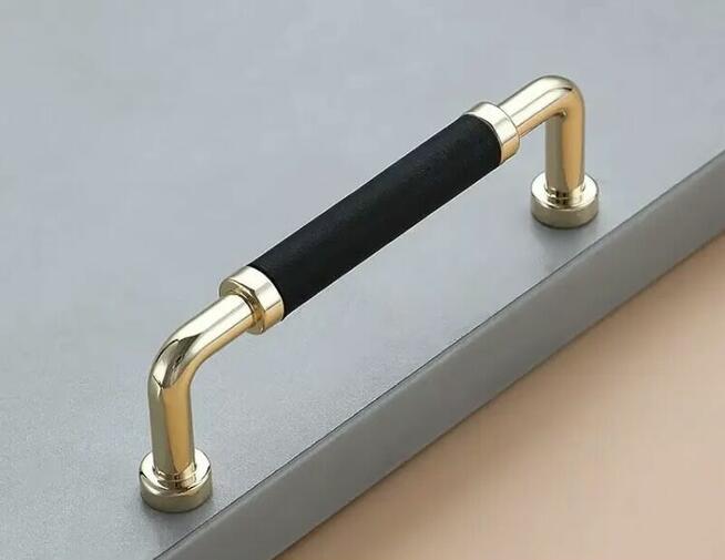 Nowoczesny uchwyt meblowy z serii LEONI złoty + czarny
