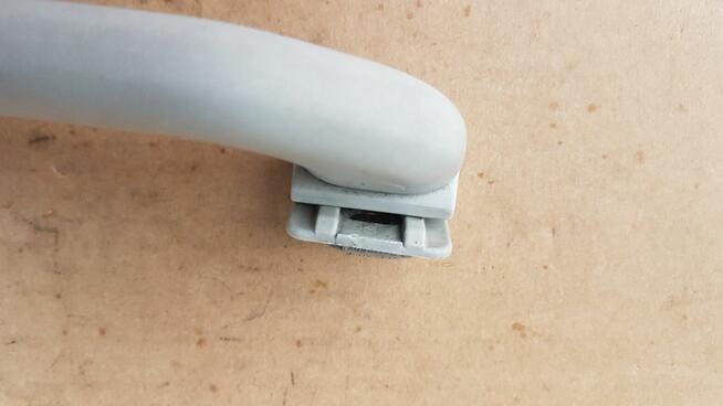 VW GOLF III UCHWYT RĄCZKA PODSUFITKI 1H0857607